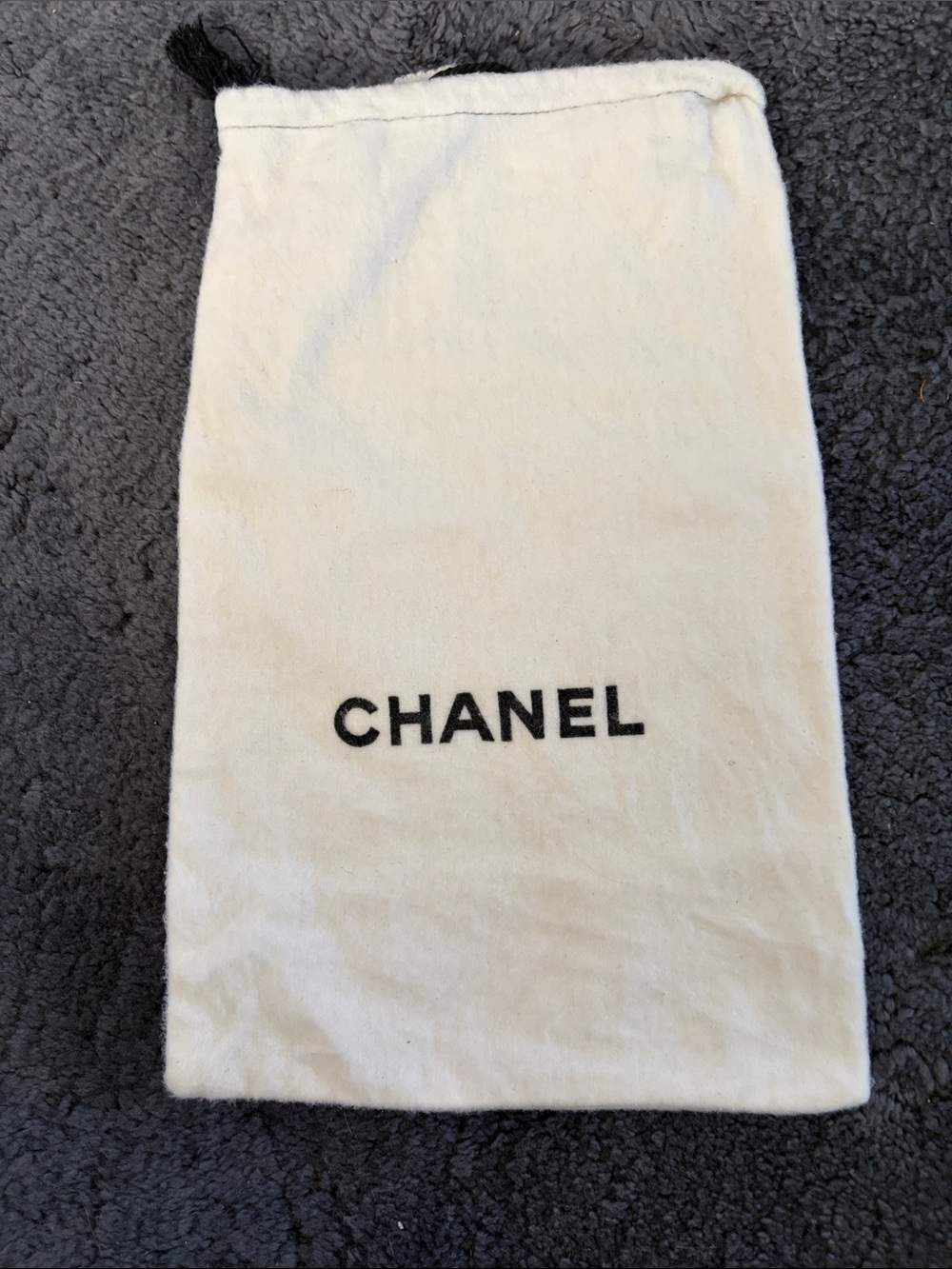 CHANEL Cream Drawstring Pouch with Black Logo